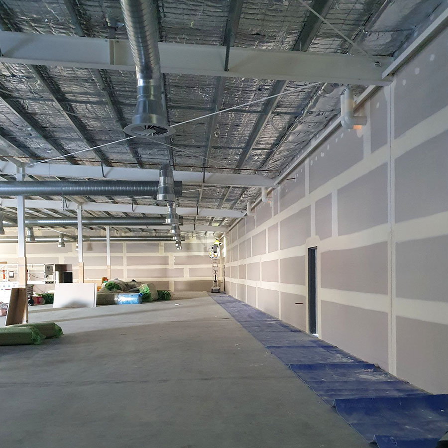 Plastering a commercial warehouse